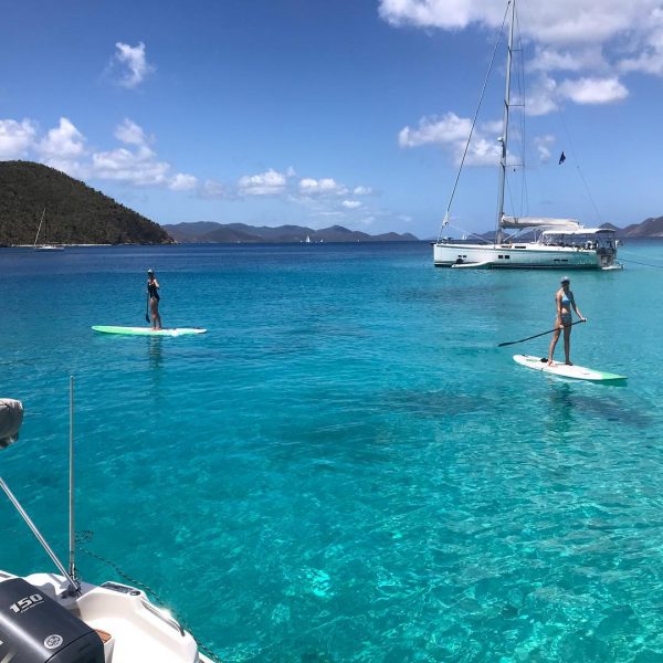 Paddle boarding for health and wellness while on Sea Boss