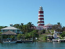 Famous candy-striped lighthouse in Hope Town on Elbow Cay. Visit it during your Abacos Bahamas Yacht Charter