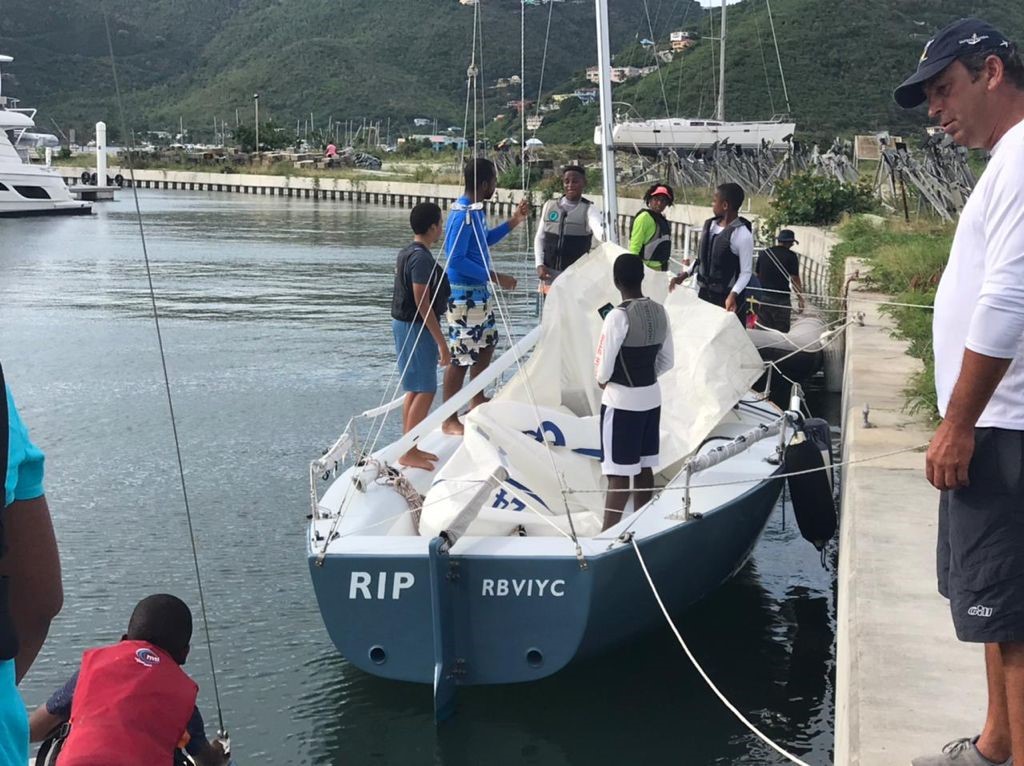 KATS youth preparing their boat for a sailing lesson.