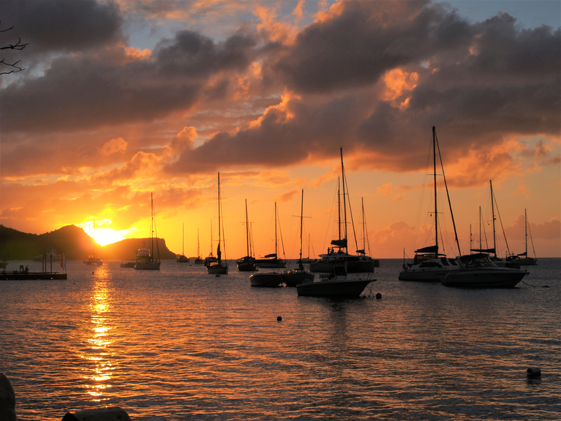 Enjoying the sunset on your first night onboard your yacht in Admiralty Bay, Bequia