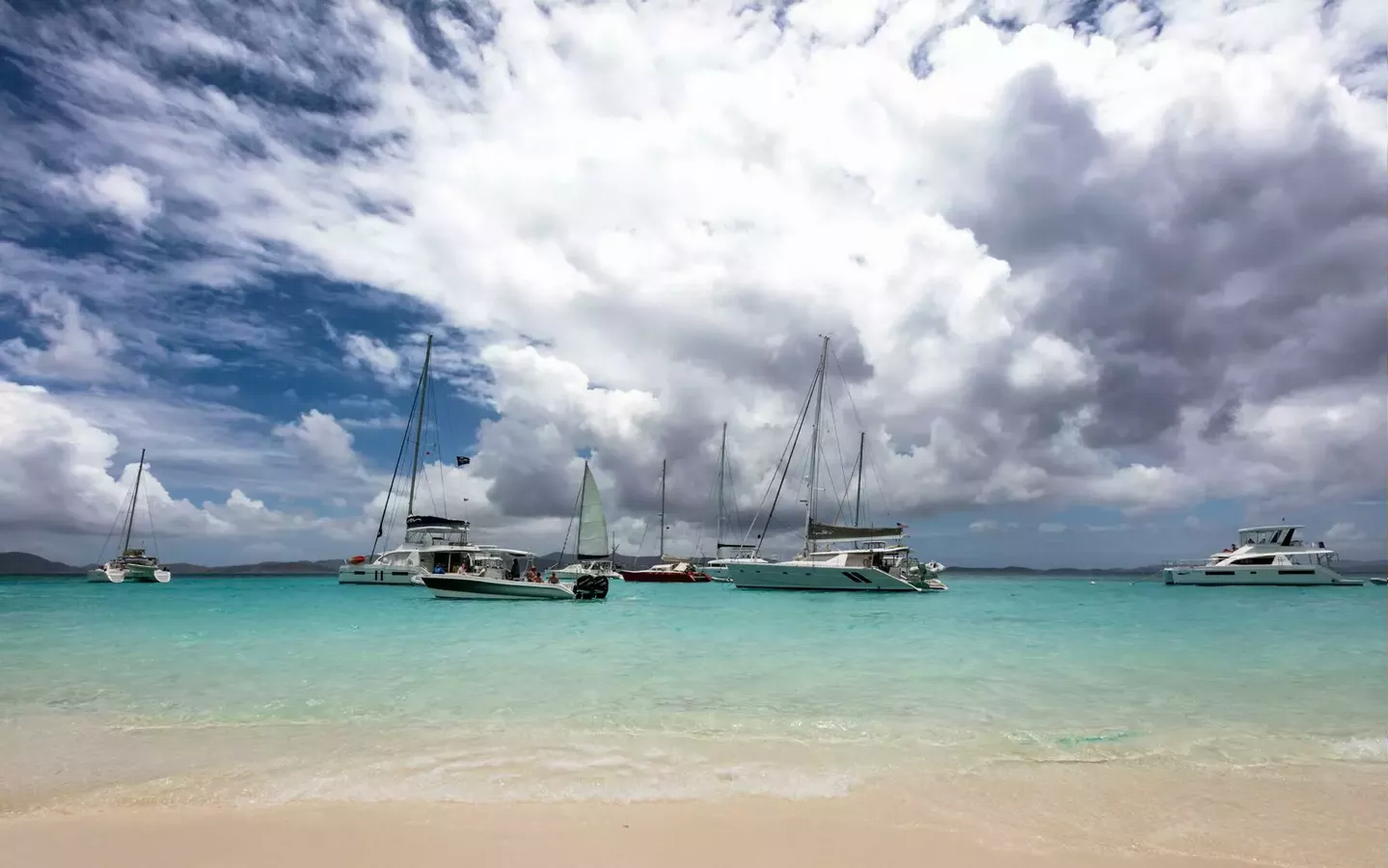 Yachts docked ashore the beach - Charter in the USVI BVI or both?