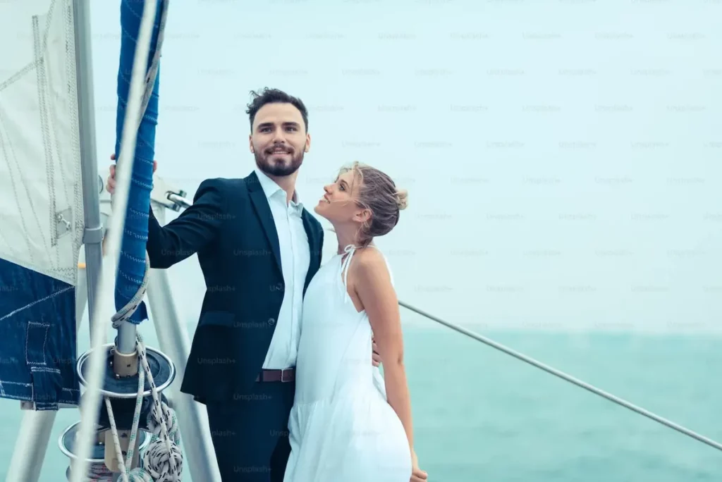 couple on a yacht for a Bahamas honeymoon and wedding