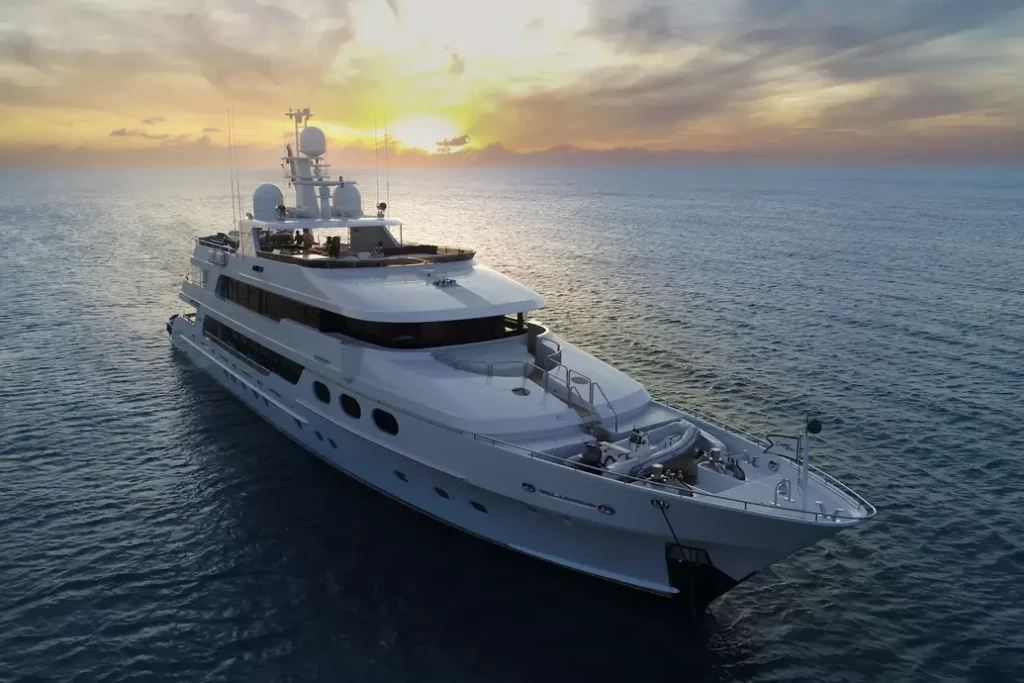 sunset aerial view of a luxury yacht charter - charter BVI with crew