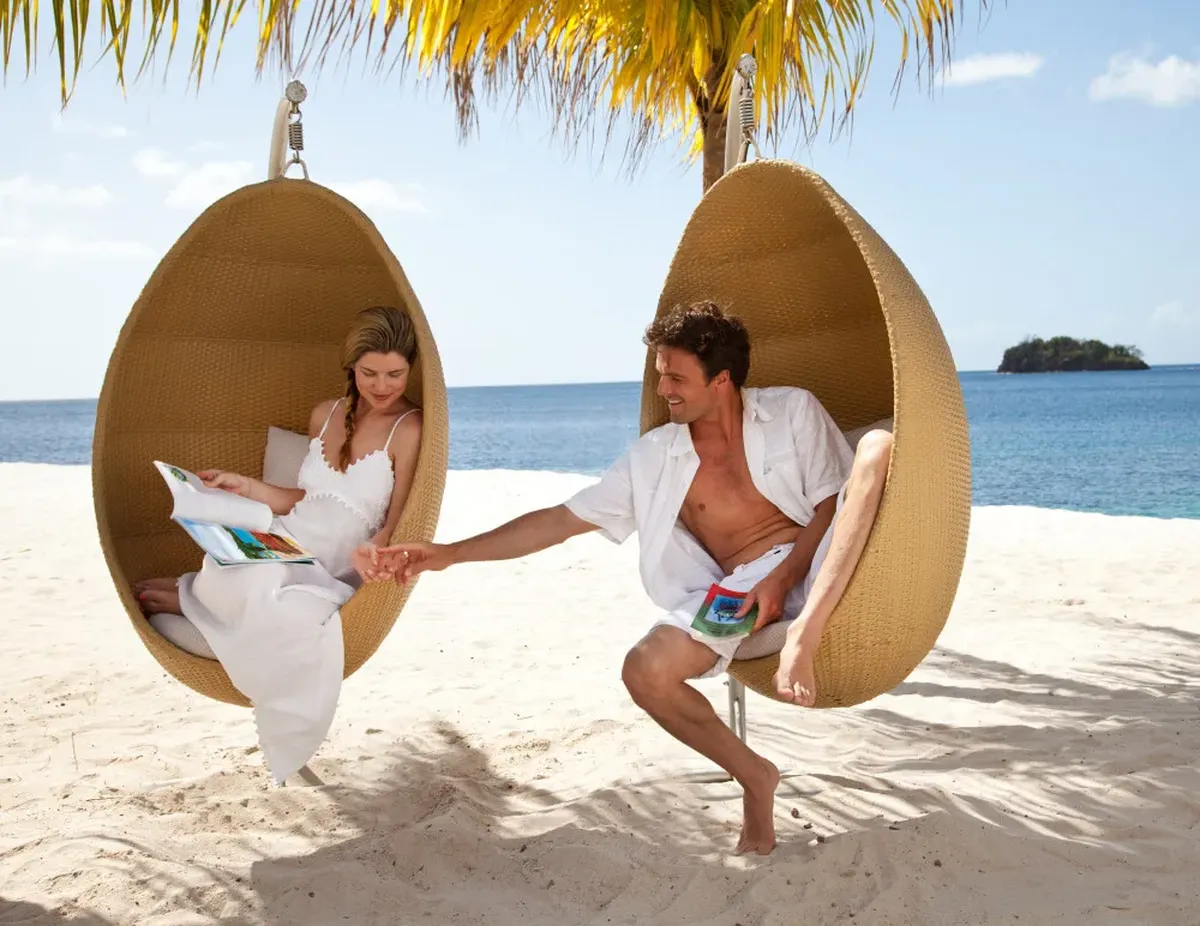 a couple in an exclusive island - romantic BVI sailing vacation